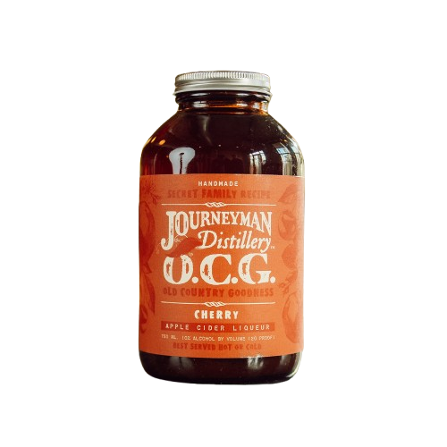 Bottle of Journeyman Distillery O.C.G. Cherry Apple Cider Liqueur on a white background